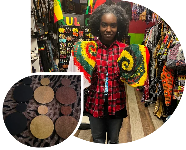 Woman models wooden earrings in shop.