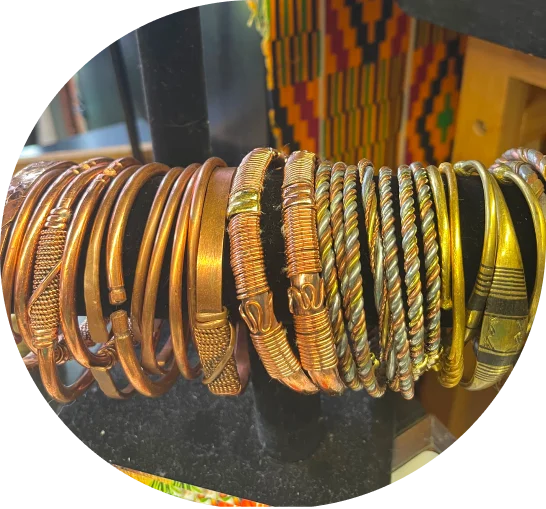 Copper and wire bracelets on display.