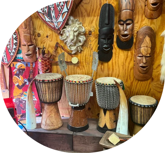 African drums and masks on wood.